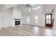 Living room with vaulted ceiling, fireplace, and hardwood floors at 9449 Oak Grove Rd # Lot 4, Stanfield, NC 28163