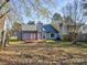 View of the home from the backyard, showcasing the deck and fence at 11324 Kingfisher Dr, Charlotte, NC 28226