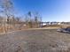 Backyard view showcasing a grassy area and neighborhood homes at 15533 Capps Rd, Charlotte, NC 28278