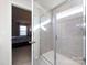 Bathroom with glass shower and view into bedroom at 15533 Capps Rd, Charlotte, NC 28278