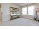 Spacious bedroom featuring a large window and decorative shelving at 15533 Capps Rd, Charlotte, NC 28278