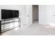 Bedroom with TV stand, door to hallway, and carpet flooring at 15533 Capps Rd, Charlotte, NC 28278