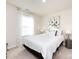 Bedroom with large bed and artwork above at 15533 Capps Rd, Charlotte, NC 28278