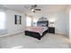 Comfortable bedroom with ceiling fan and ensuite bathroom access at 15533 Capps Rd, Charlotte, NC 28278