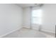 Bright bedroom with window, blinds, and neutral walls at 15533 Capps Rd, Charlotte, NC 28278