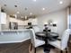 Charming dining area with a round table and leopard print chairs at 15533 Capps Rd, Charlotte, NC 28278