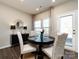 Bright dining area with lots of natural light and seating for four at 15533 Capps Rd, Charlotte, NC 28278