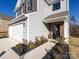 Front entrance with stone accents and landscaping at 15533 Capps Rd, Charlotte, NC 28278