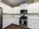 Modern kitchen with stainless steel appliances and white cabinetry at 15533 Capps Rd, Charlotte, NC 28278