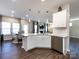 Eat-in kitchen with island, stainless steel appliances, and white cabinets at 15533 Capps Rd, Charlotte, NC 28278