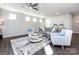 Bright living room with hardwood floors and a cozy seating area at 15533 Capps Rd, Charlotte, NC 28278