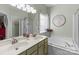 Bathroom with double vanity, garden tub, and separate shower at 16039 Lavenham Rd, Huntersville, NC 28078