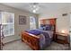 Charming bedroom featuring a wooden bed frame and large windows at 16039 Lavenham Rd, Huntersville, NC 28078