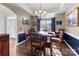 Dining room with hardwood floors, chandelier, and window views at 16039 Lavenham Rd, Huntersville, NC 28078