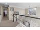 Upstairs hallway with view of living area and bedroom at 16039 Lavenham Rd, Huntersville, NC 28078