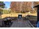 Stone patio with firepit and grill, perfect for grilling at 16039 Lavenham Rd, Huntersville, NC 28078