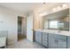 Double vanity bathroom with a large mirror and marble flooring at 2529 Crimson Way, Monroe, NC 28112