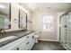 Modern bathroom with granite countertops, double sinks, and a large shower at 316 Reed Creek Rd, Mooresville, NC 28117