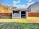 Gray storage shed with black door and window at 316 Weavers Glenn Pl, Charlotte, NC 28262