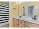 Bright bathroom with double sinks and a striped shower curtain at 4263 Belle Meade Cir, Belmont, NC 28012