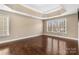 Bedroom with hardwood floors and tray ceiling, offering abundant natural light at 4263 Belle Meade Cir, Belmont, NC 28012