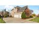 Two-story house with a side load garage and basketball court at 4263 Belle Meade Cir, Belmont, NC 28012