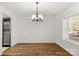 Elegant dining room with chandelier and hardwood floors at 5212 Fair Wind Ln, Charlotte, NC 28212