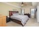 Main bedroom with a ceiling fan and large windows at 6428 Hasley Woods Dr, Huntersville, NC 28078