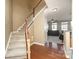 Hardwood staircase leading to the second floor of the home at 6428 Hasley Woods Dr, Huntersville, NC 28078