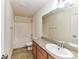 Clean bathroom with granite countertop, bathtub, and toilet at 7534 April Mist Trl, Huntersville, NC 28078