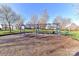 Community playground with swings set on wood chips at 7534 April Mist Trl, Huntersville, NC 28078