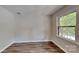 Bright bedroom with new flooring and a large window at 849 Nottingham Dr, Gastonia, NC 28054