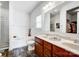 Modern bathroom with double vanity, soaking tub, shower, and wooden cabinets at 107 Meadowcreek Village Dr, Locust, NC 28097