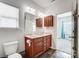 Clean bathroom featuring double vanity, wooden cabinetry, and modern fixtures at 107 Meadowcreek Village Dr, Locust, NC 28097