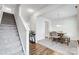 Dining area with a table, chairs, and staircase access at 107 Meadowcreek Village Dr, Locust, NC 28097