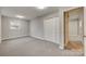 Well-lit bedroom with neutral decor and closet at 109 Belton Ave, Mount Holly, NC 28120