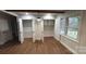 Bright laundry room with built-in shelving and cabinets at 1327 Marble St, Charlotte, NC 28208