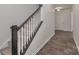 Modern entryway with dark wood staircase and gray wood-look tile floor at 202 Hidden Lakes Rd # 152, Statesville, NC 28677