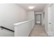 Bright hallway with neutral walls and carpeting at 202 Hidden Lakes Rd # 152, Statesville, NC 28677