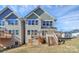 Two-story townhome with deck and stairs leading to backyard at 208 Pawley Dr, Charlotte, NC 28214