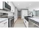 Modern kitchen with stainless steel appliances and a farmhouse sink at 208 Pawley Dr, Charlotte, NC 28214