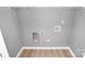 Convenient laundry area with built-in shelving at 212 Pawley Dr, Charlotte, NC 28214