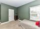 Serene bedroom with a twin bed and green walls at 225 Jaida Ln, Oakboro, NC 28129