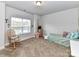 Cozy bedroom with rocking chair and window seat at 225 Jaida Ln, Oakboro, NC 28129