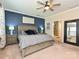 Primary bedroom with a king-size bed, ample natural light and a view of the bathroom at 2353 Talon Point Cir, Fort Mill, SC 29715