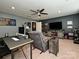 Bonus room with home office, comfy seating, and large TV at 2353 Talon Point Cir, Fort Mill, SC 29715