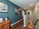 Upstairs hallway with hardwood floors and decorative artwork at 2353 Talon Point Cir, Fort Mill, SC 29715