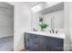 Modern bathroom with double vanity, dark gray cabinets, and quartz countertop at 2410 Forrestbrook Dr, Kannapolis, NC 28083