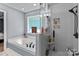 Bathroom boasts a soaking tub, a glass-door shower, and tile surround at 244 Whisper Dr, China Grove, NC 28023