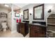 Elegant bathroom with double vanity, dark wood cabinetry, and tiled floors at 3500 Colony Rd # A, Charlotte, NC 28211